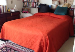 Our bed -- made every morning -- thanks to Kit