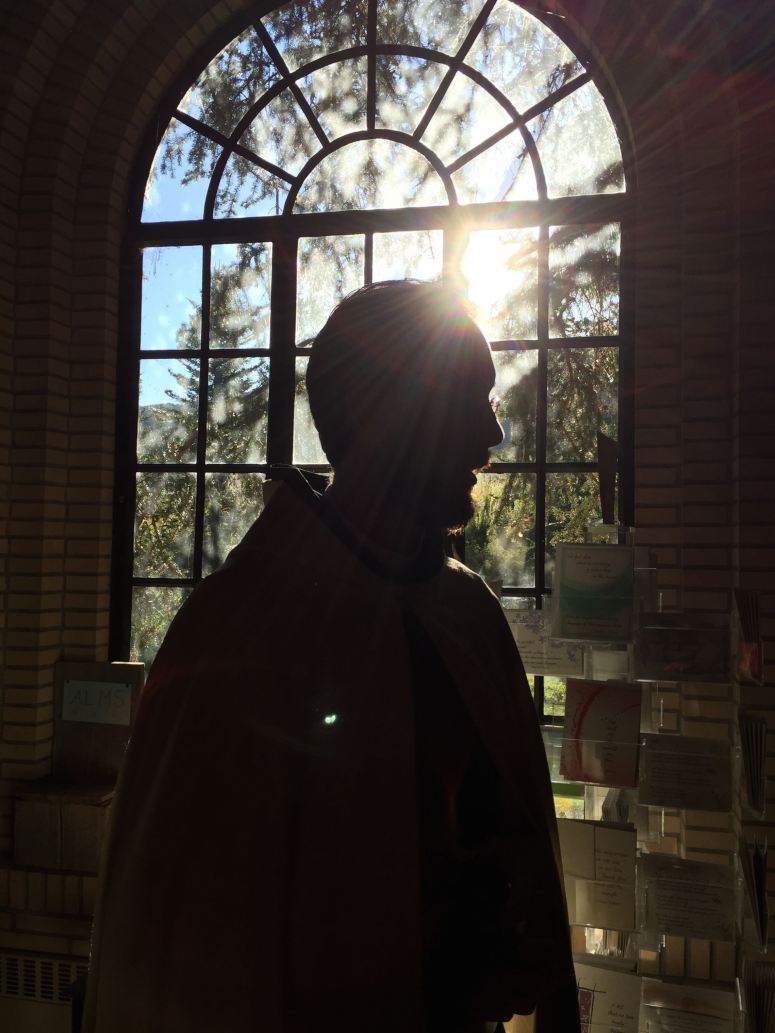 A Benedictine monk (Aaron) in the monastery bookstore.